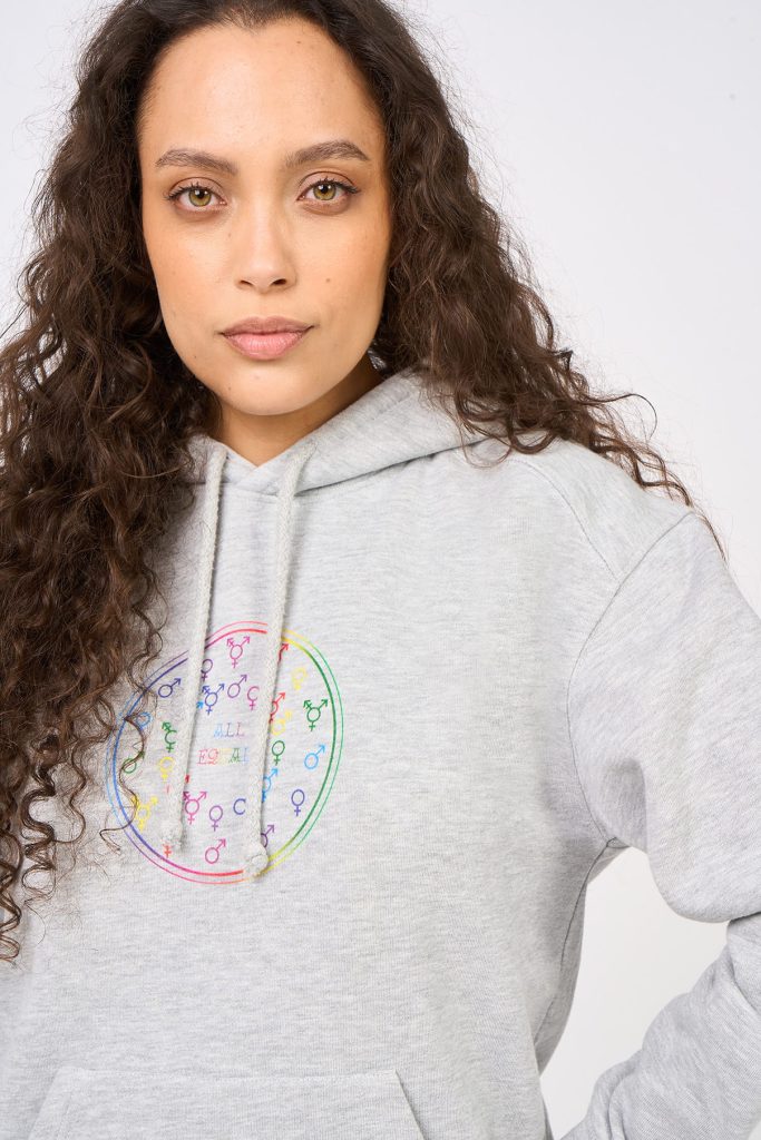 Heather grey sweatshirt with multicoloured All Equal motif in the name of an inclusive society, worn by female model